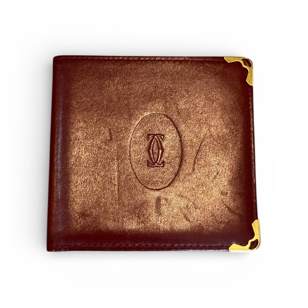 Cartier Men’s Deep Red Leather Bifold with Gold Corners